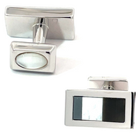 S221 Cufflink rectangular cufflinks feature one black glass inlay and one translucent white oval insert on the backing